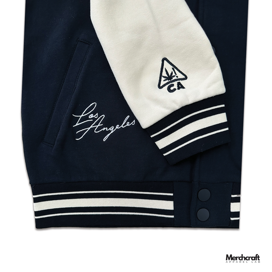 Detailed embroidered varsity jacket sleeve showing crisp stitched logos on structured fabric