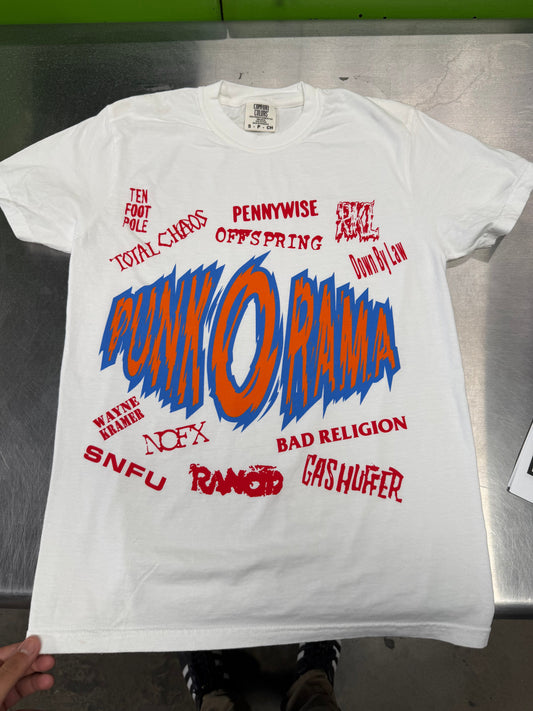 White T-shirt with a large blue and orange graphic and surrounding red lettering
